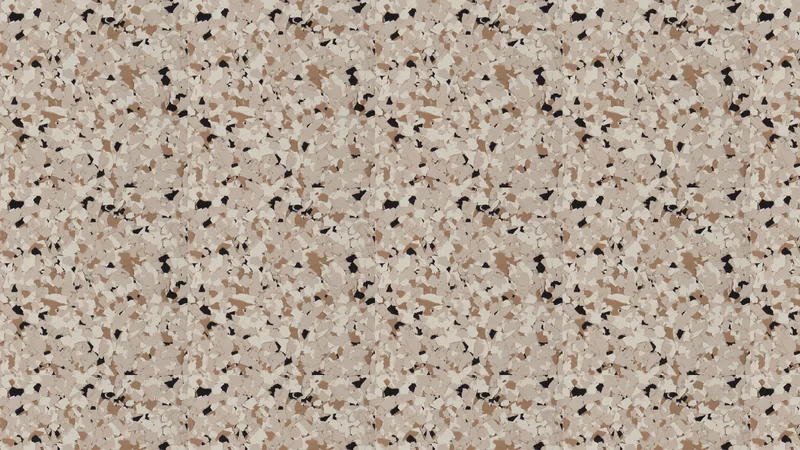 A decorative concrete finish in beige with dark and cream flecks.