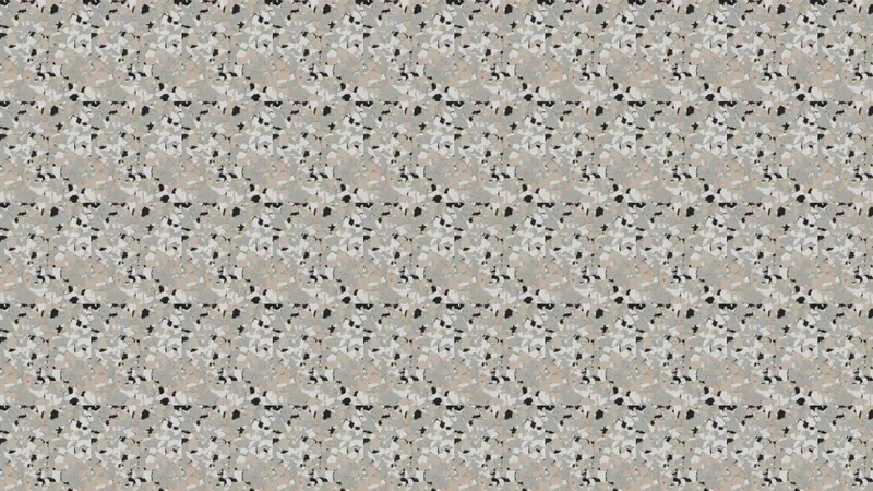 A decorative concrete finish in grey with a fine pebble texture.