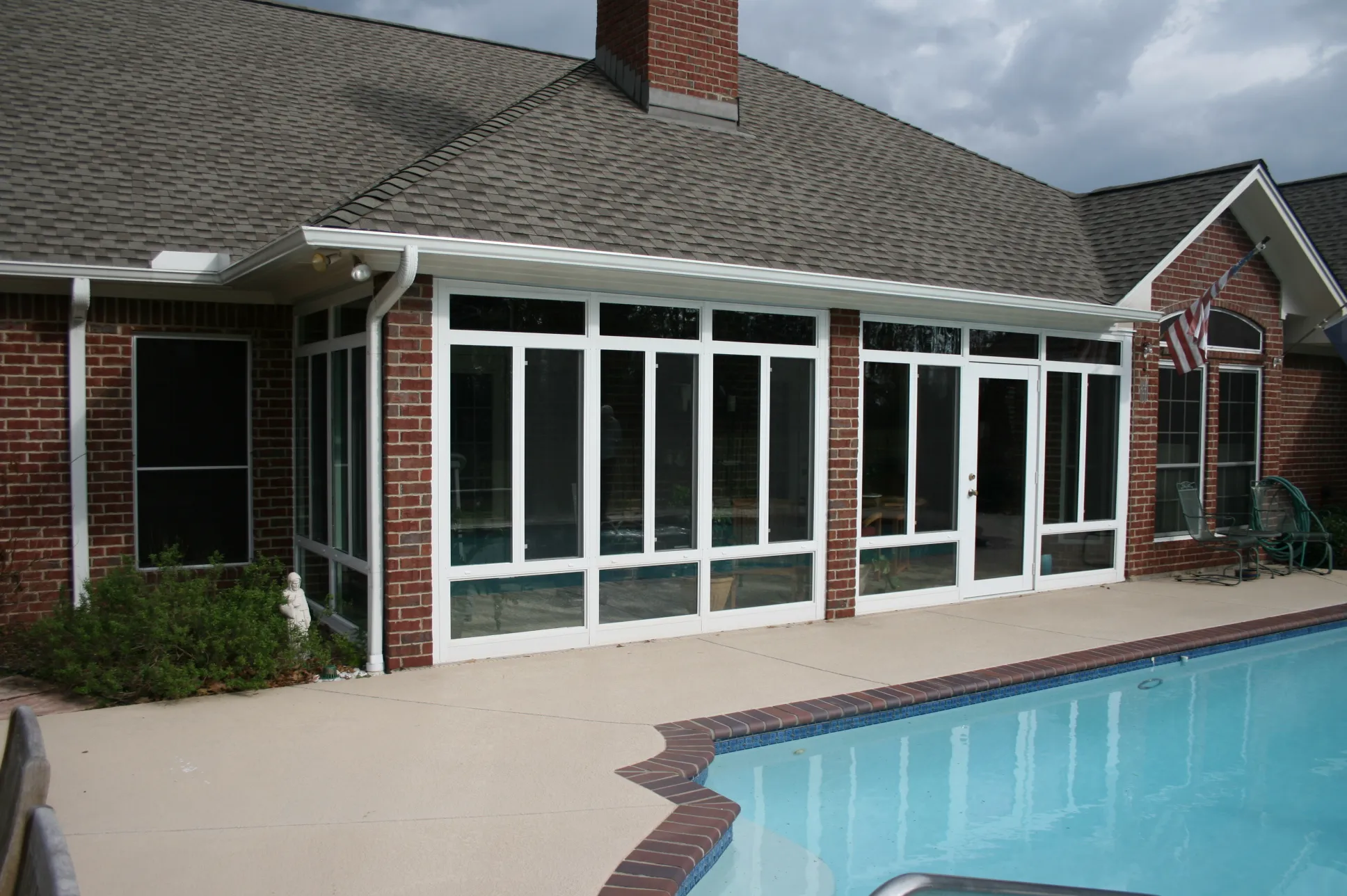 Sunroom overlooking a pool