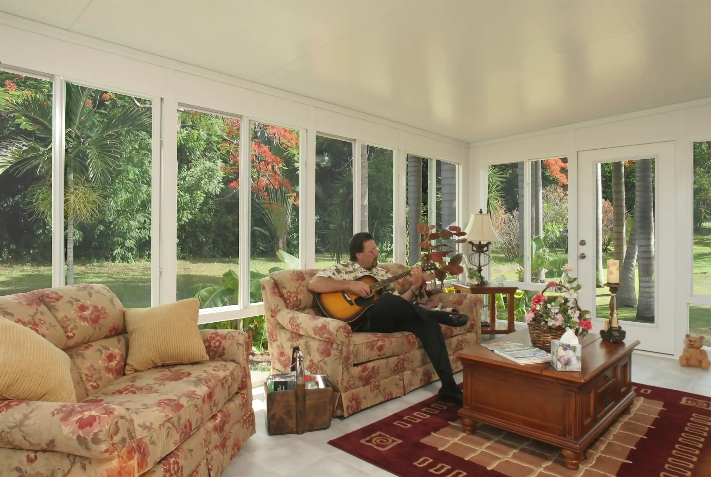 Sunroom interior looking out over the yard through glass walls