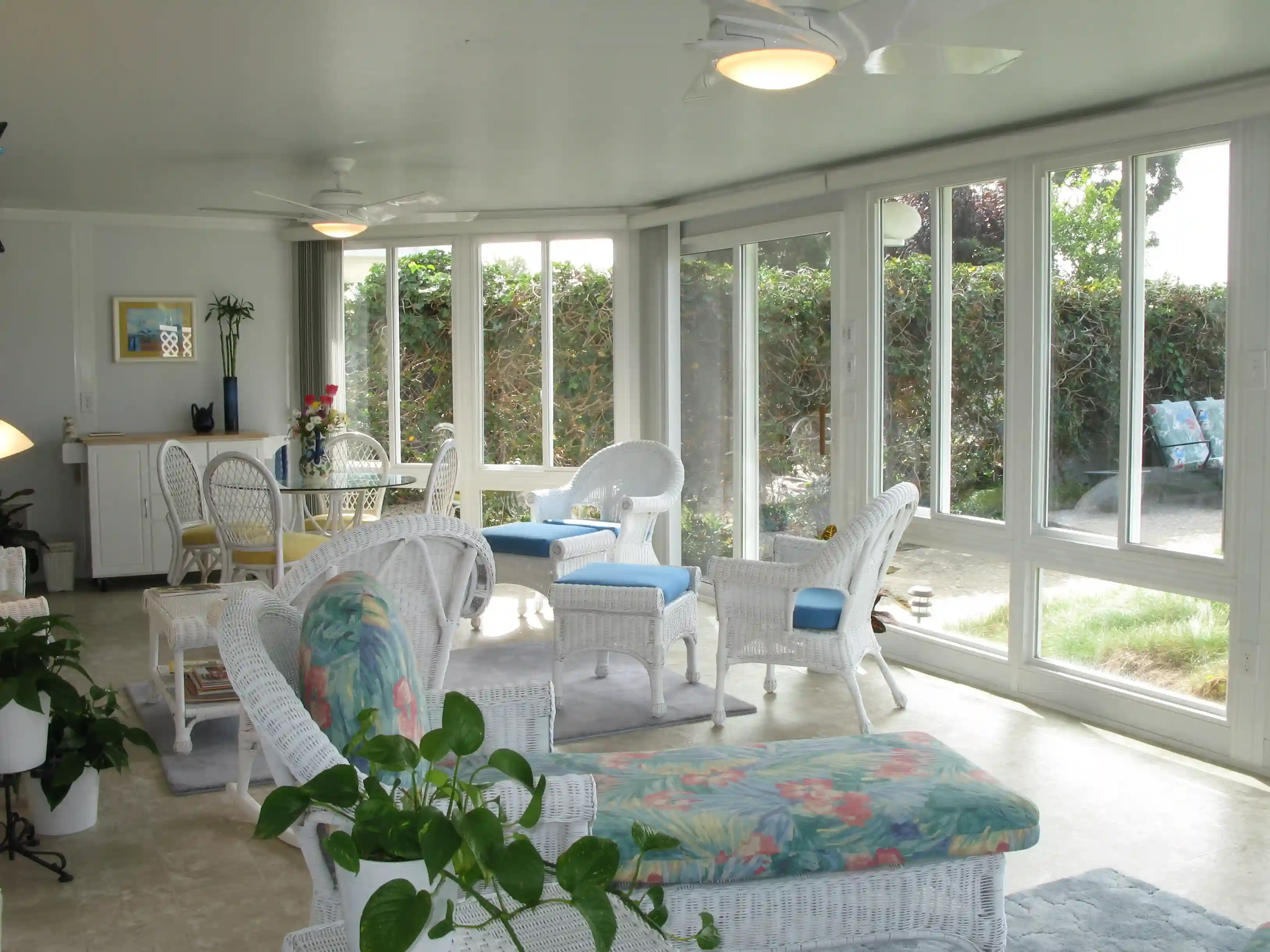 Sunroom furnished with wicker seating