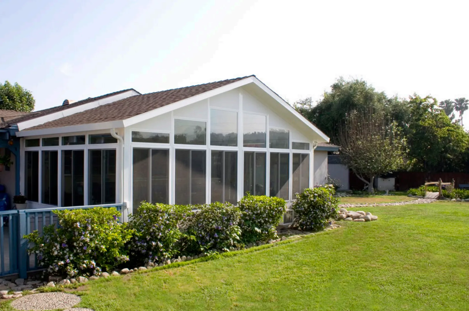 Sunroom addition with a green lawn