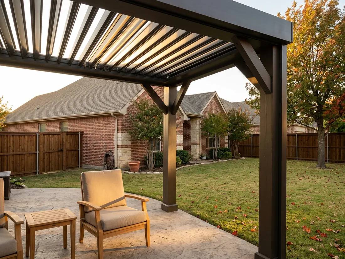 Open louvered aluminum pergola roof angled against low western sun over a Dallas patio