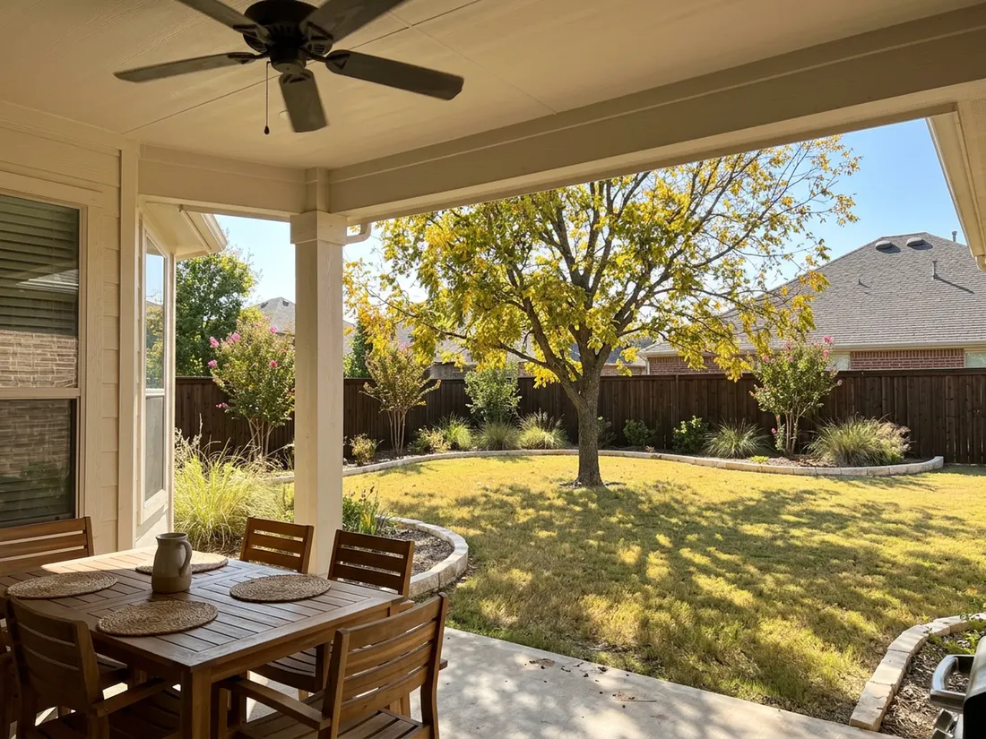 Solid-roof patio cover shading a dining table on a west-facing Texas patio in afternoon sun