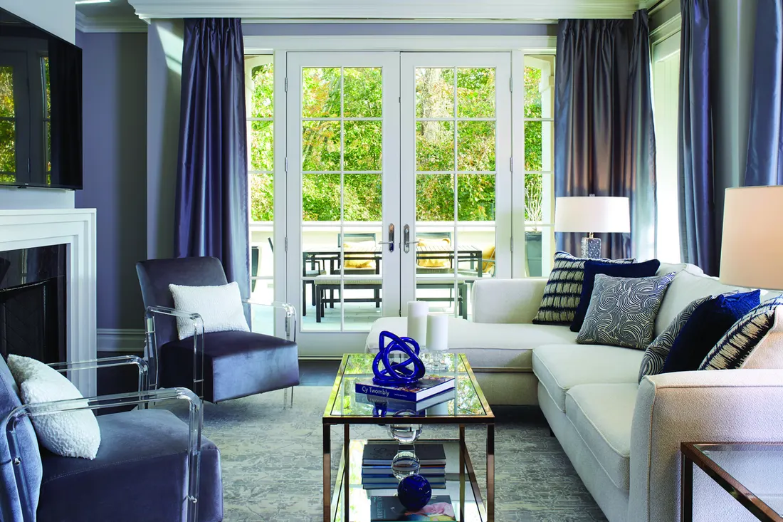 White glass French doors opening onto an outdoor patio from a modern living room