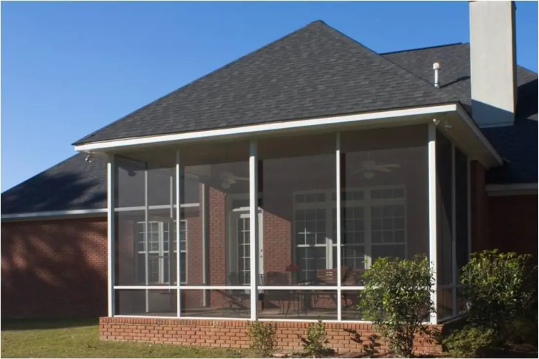 Screened enclosure on a brick home