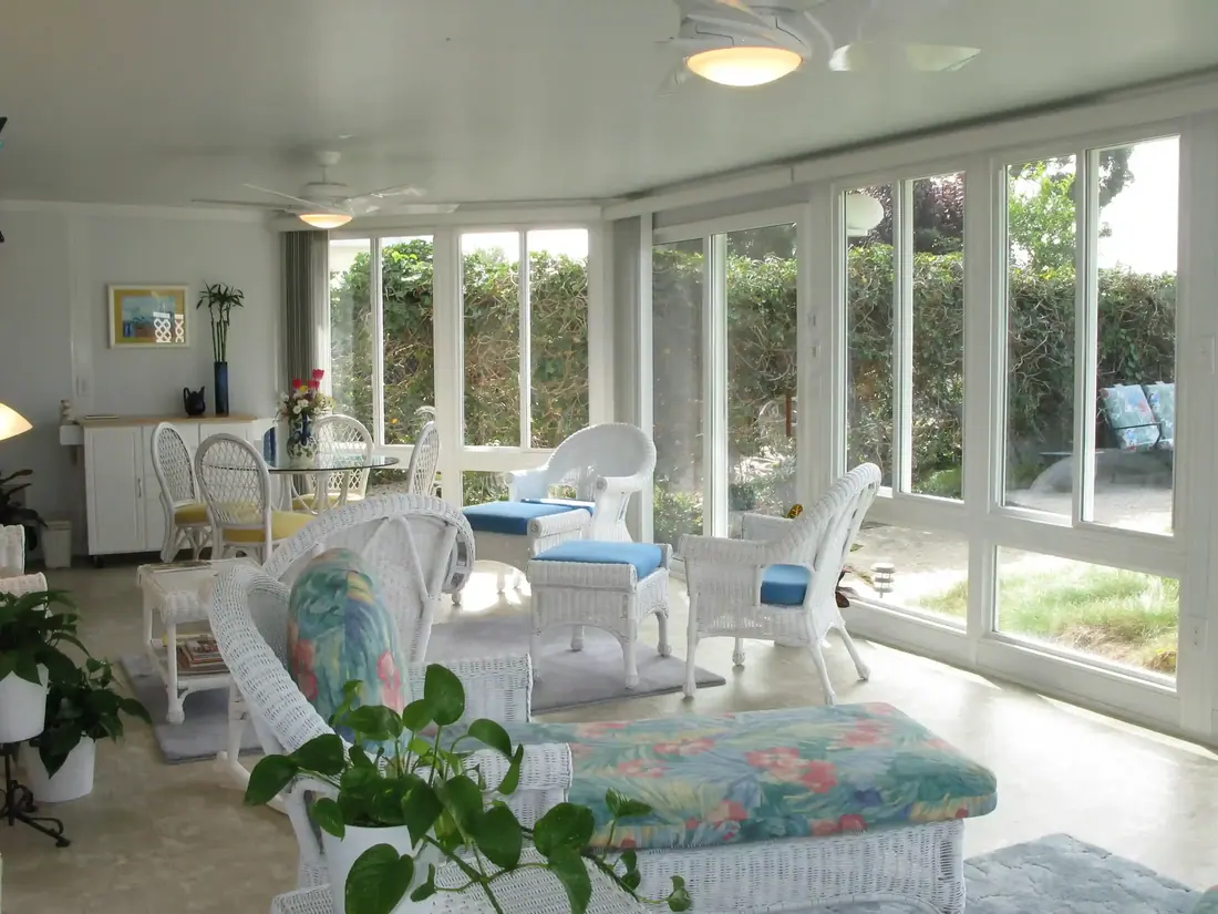 Sunroom furnished with wicker seating