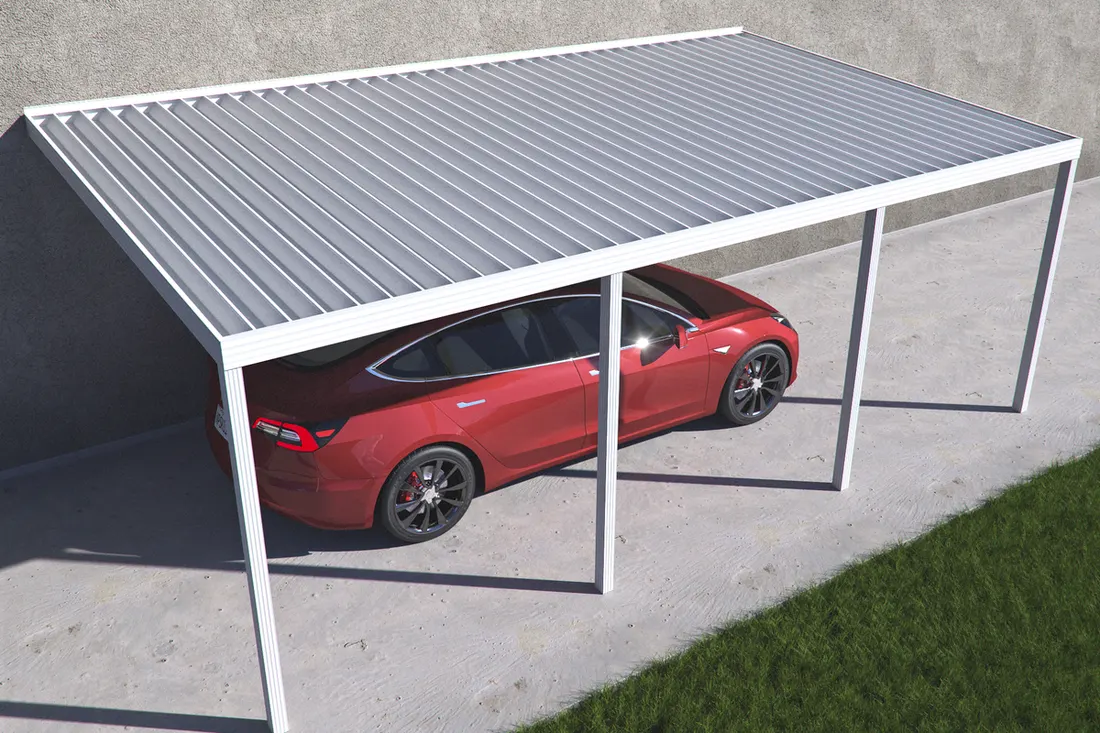 White metal attached carport covering a red car parked on a concrete driveway