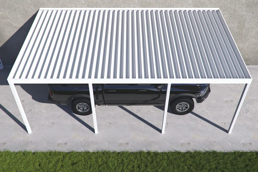 White metal louvered carport over a black pickup truck on a concrete driveway