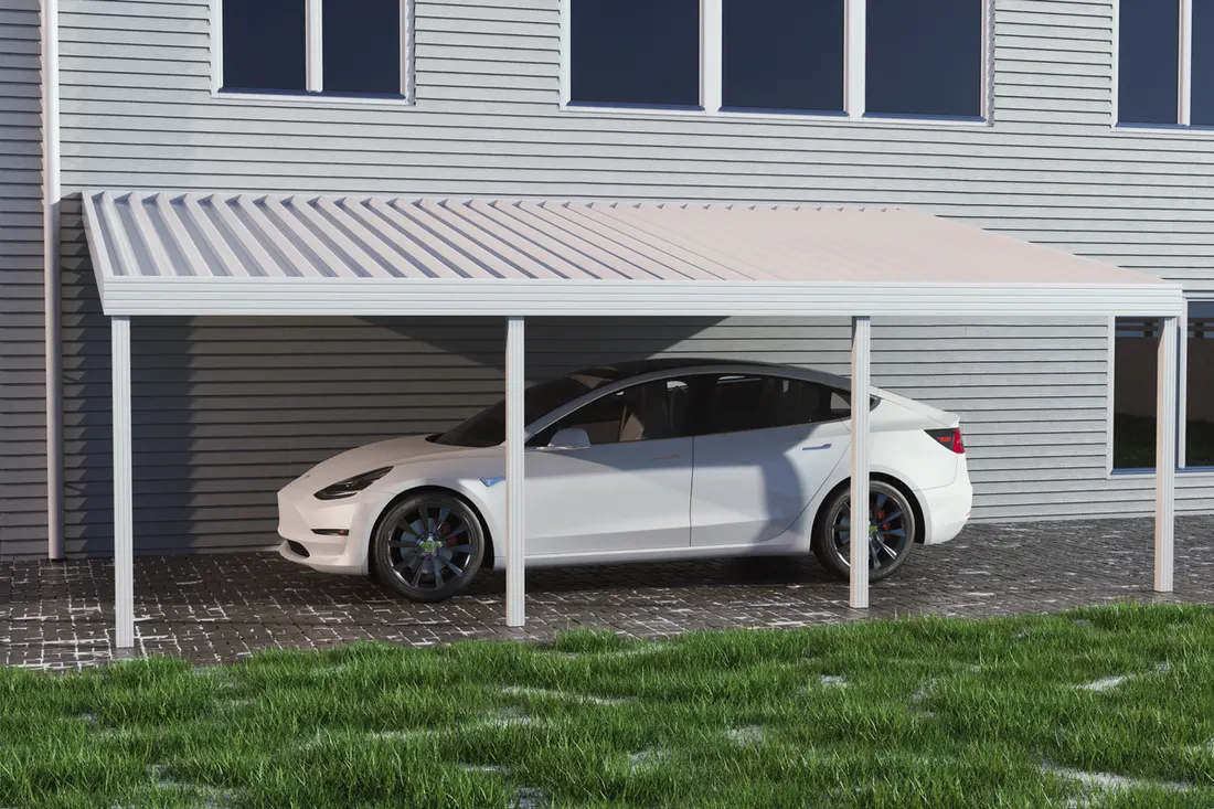 White aluminum carport attached to house covering a white sedan on a paved driveway