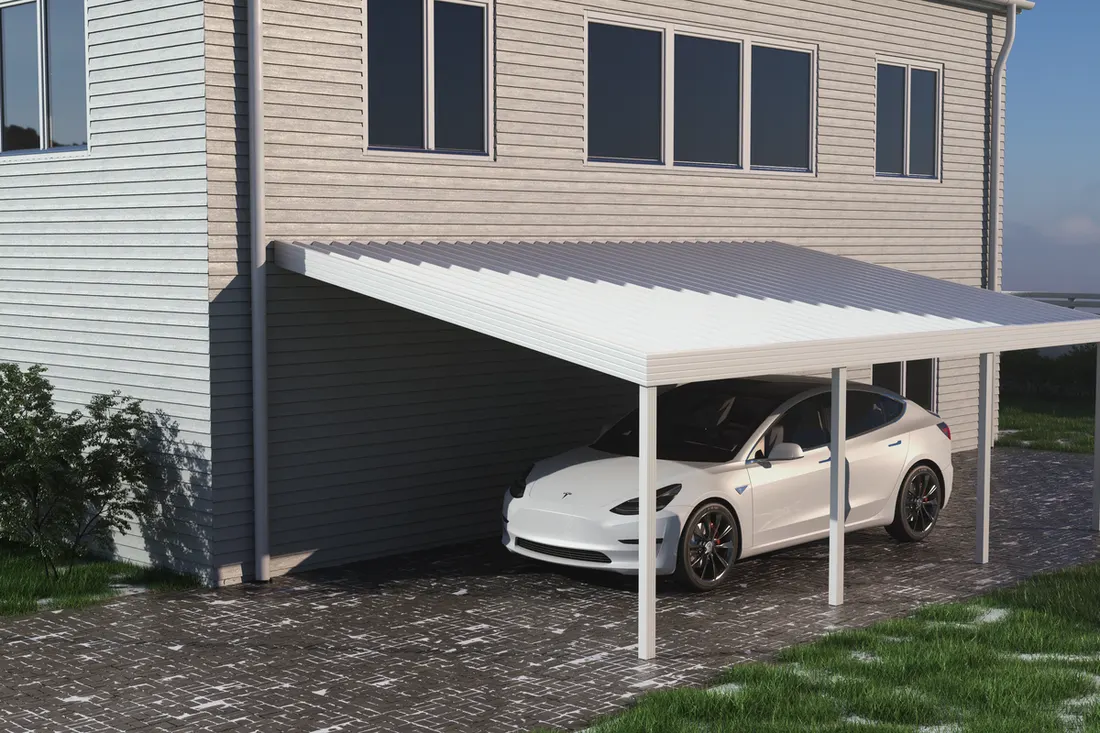 White metal carport attached to a sided house covering a car on a paved driveway
