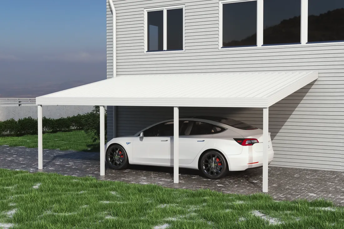 White metal attached carport sheltering a white sedan alongside a grey-sided house