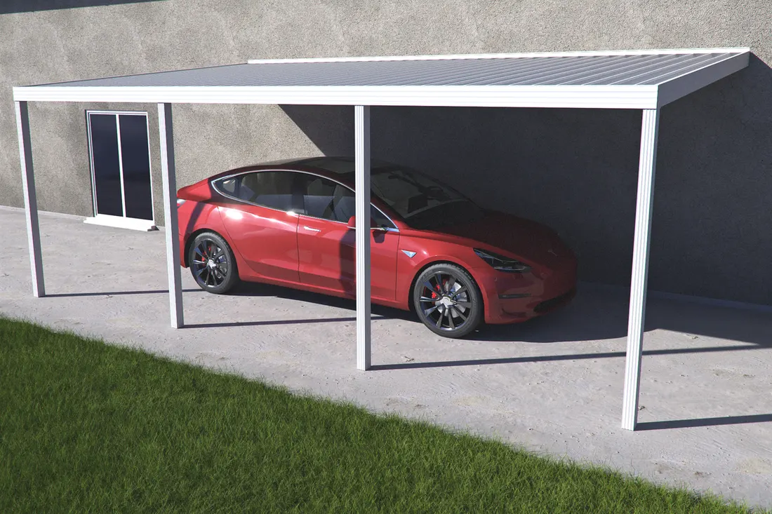 Red car parked beneath a gray metal carport beside a stucco wall and grassy lawn