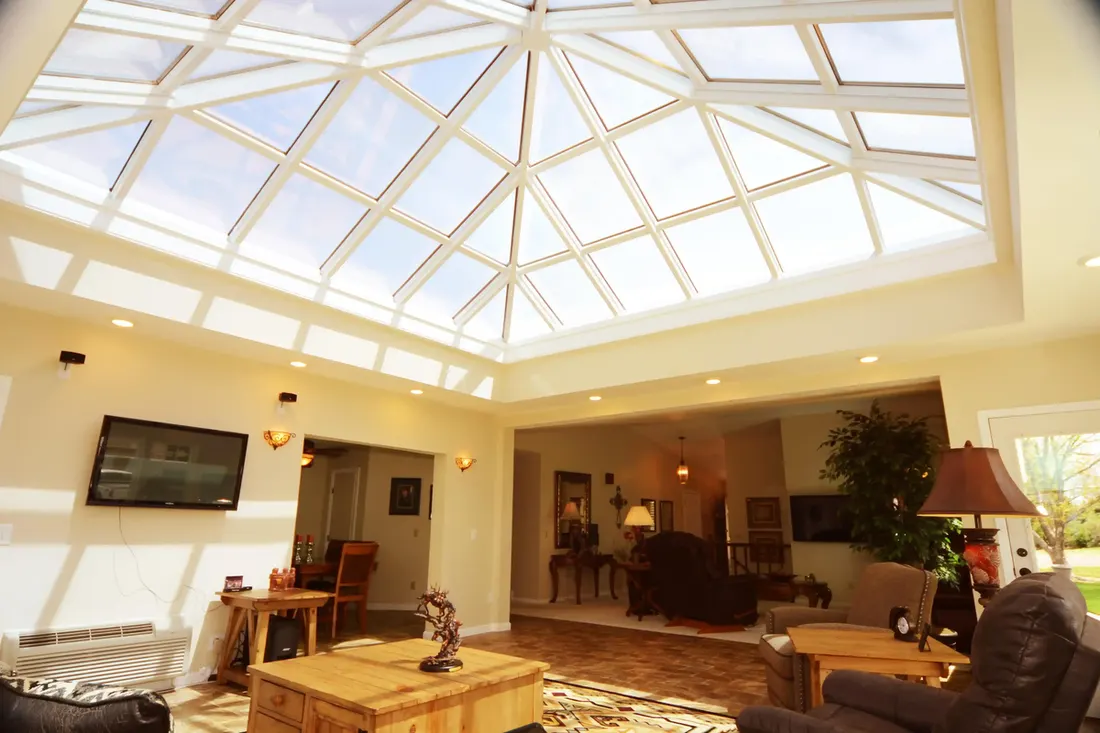 Room with a large glass-paned ceiling over a living space